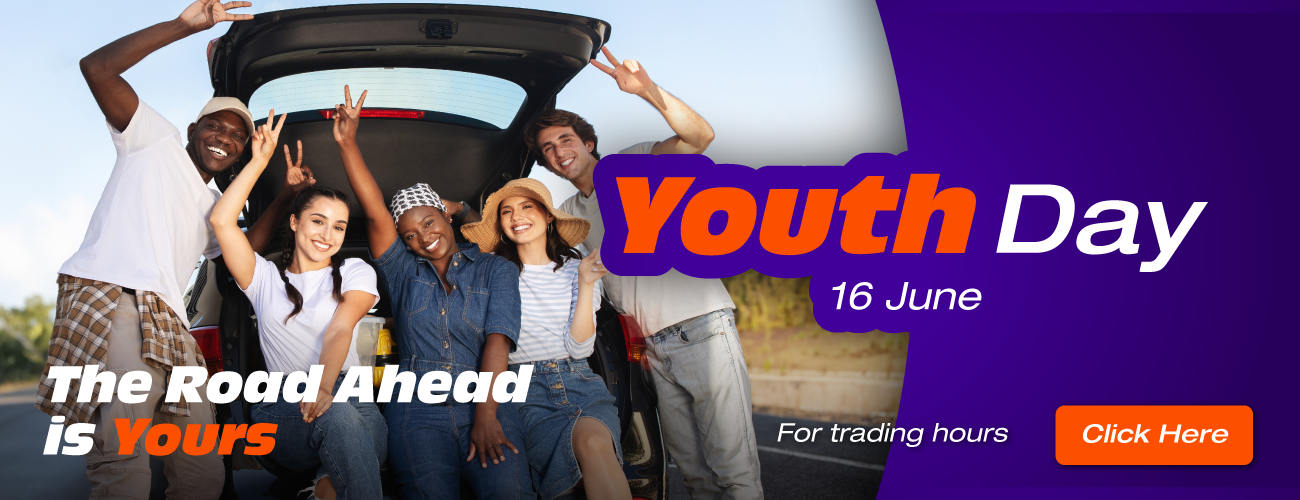 Youthful persons smiling behind the open boot of a vehicle